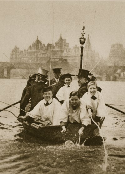 Choir boys of St. Clement Danes marking the boundaries of their parish, in a boat on the Thames by English Photographer